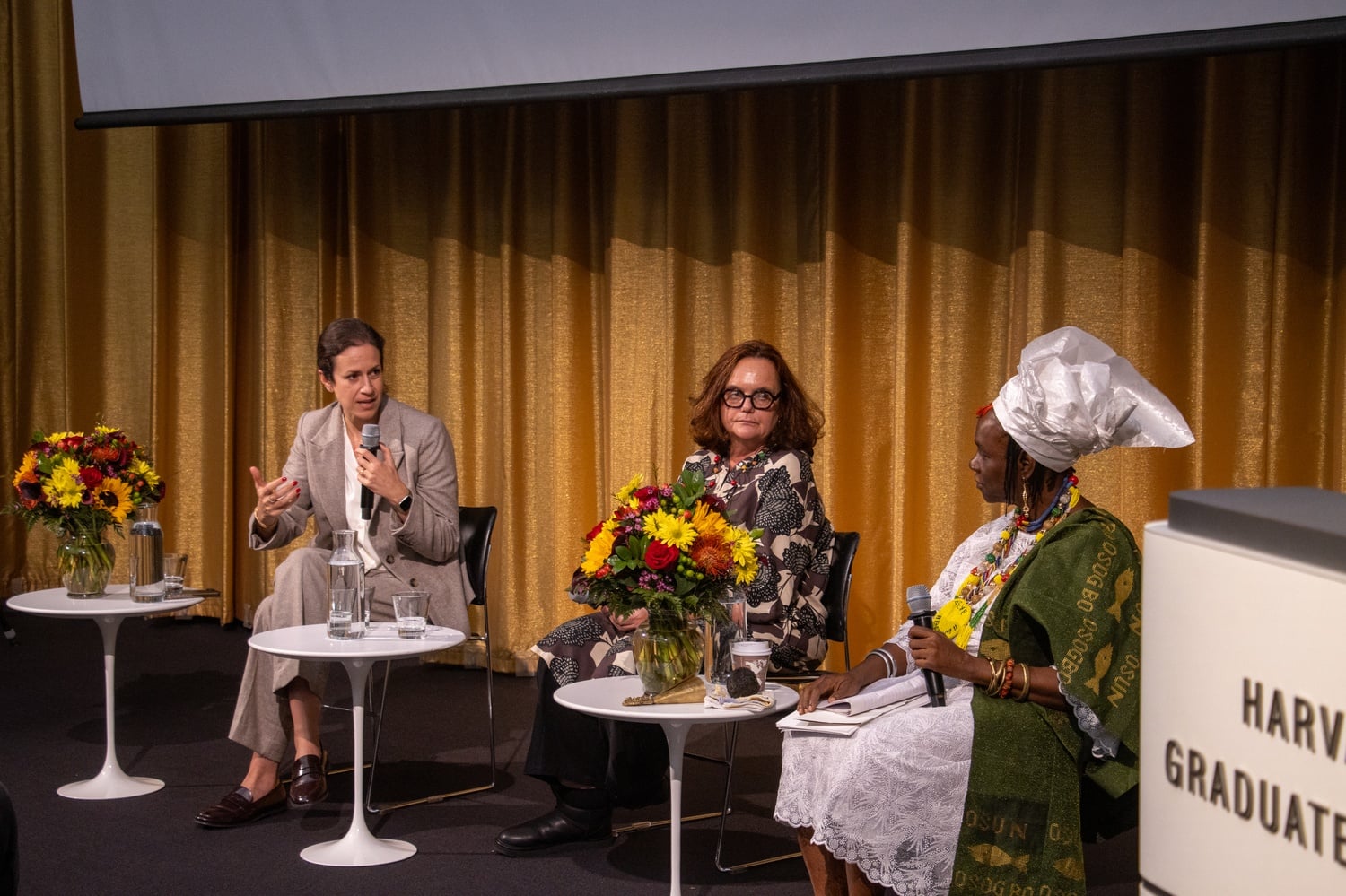 Director of the Harvard Center for African Studies Zoe Marks moderates the International Womxn's Day Keynote Address between Princess Adedoyin Talabi Faniyi of the Osun Sacred Grove in Osogbo, Nigeria, and landscape architect Tarna Klitzner at the Harvard University Graduate School of Design.