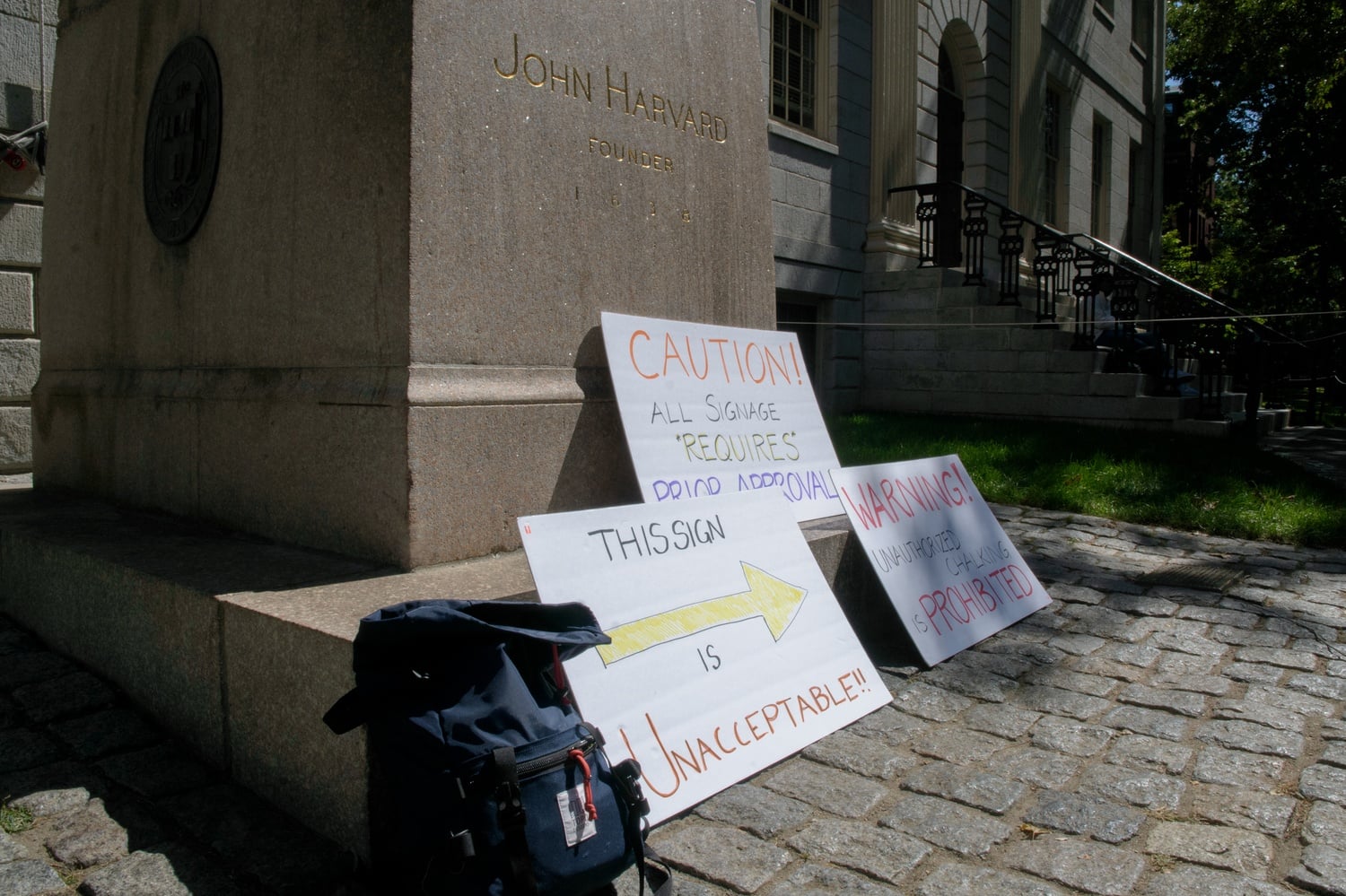 Five Harvard professors, including History professor Walter Johnson, wrote messages in chalk in Harvard Yard in protest of the University's restrictions on the use of campus spaces.