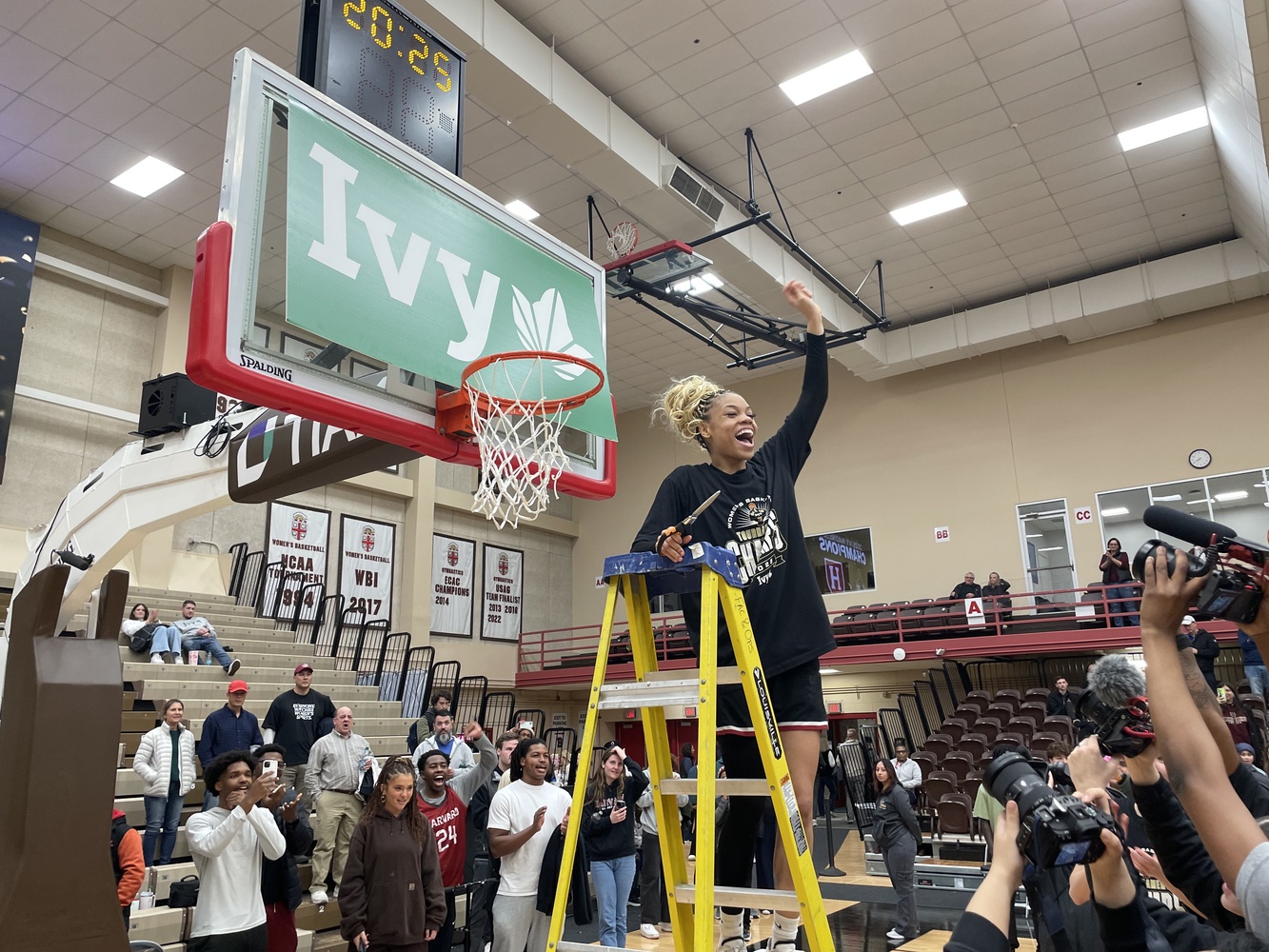 Harmoni Turner celebrates the Crimson's Ivy Madness Victory.