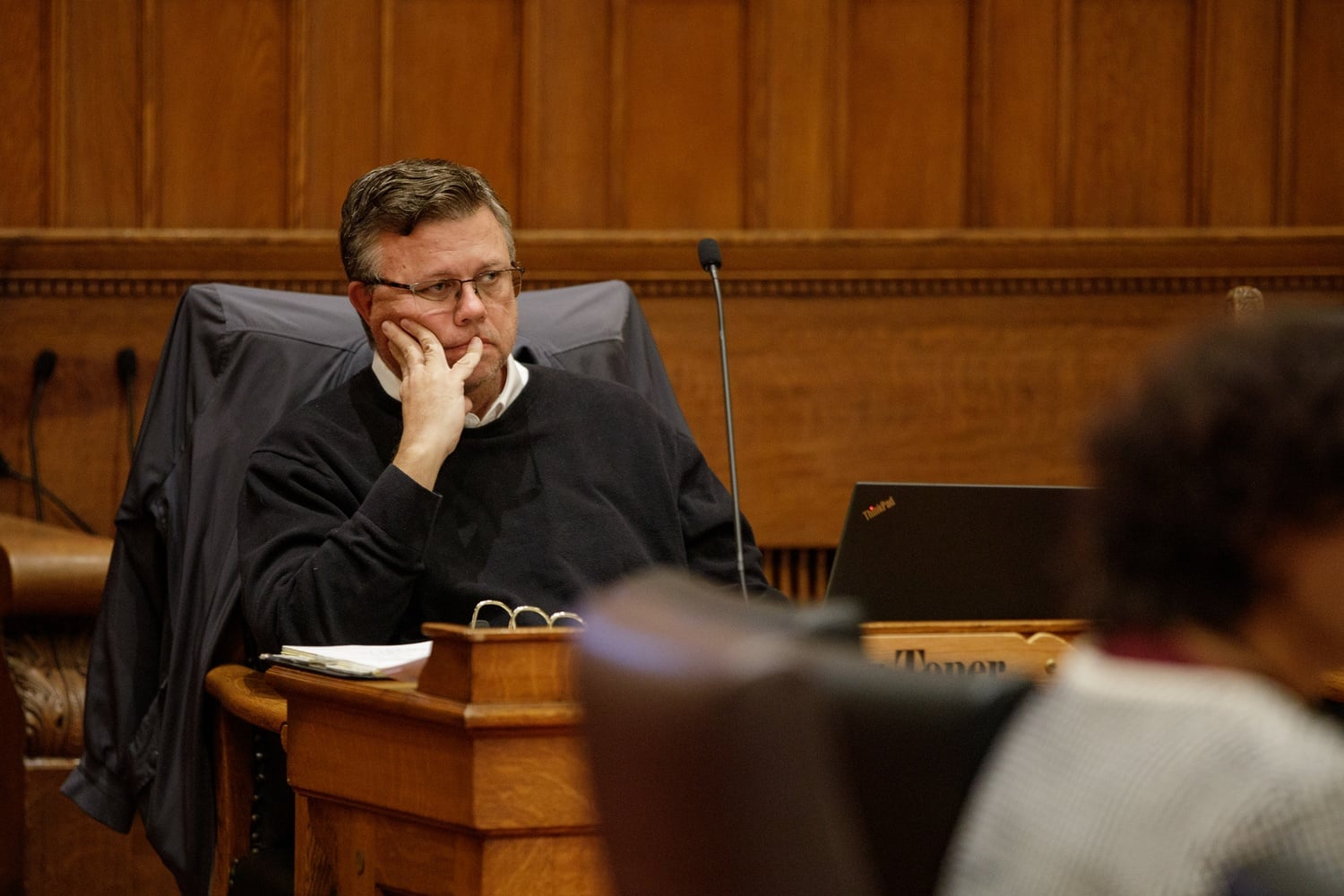 Cambridge City Councilor Paul F. Toner listens at a November 2024 meeting of the Council. In March, when Toner was named in court as an alleged patron of a brothel network that operated in Cambridge, many of his colleagues had been notified of his involvement more than a year earlier.
