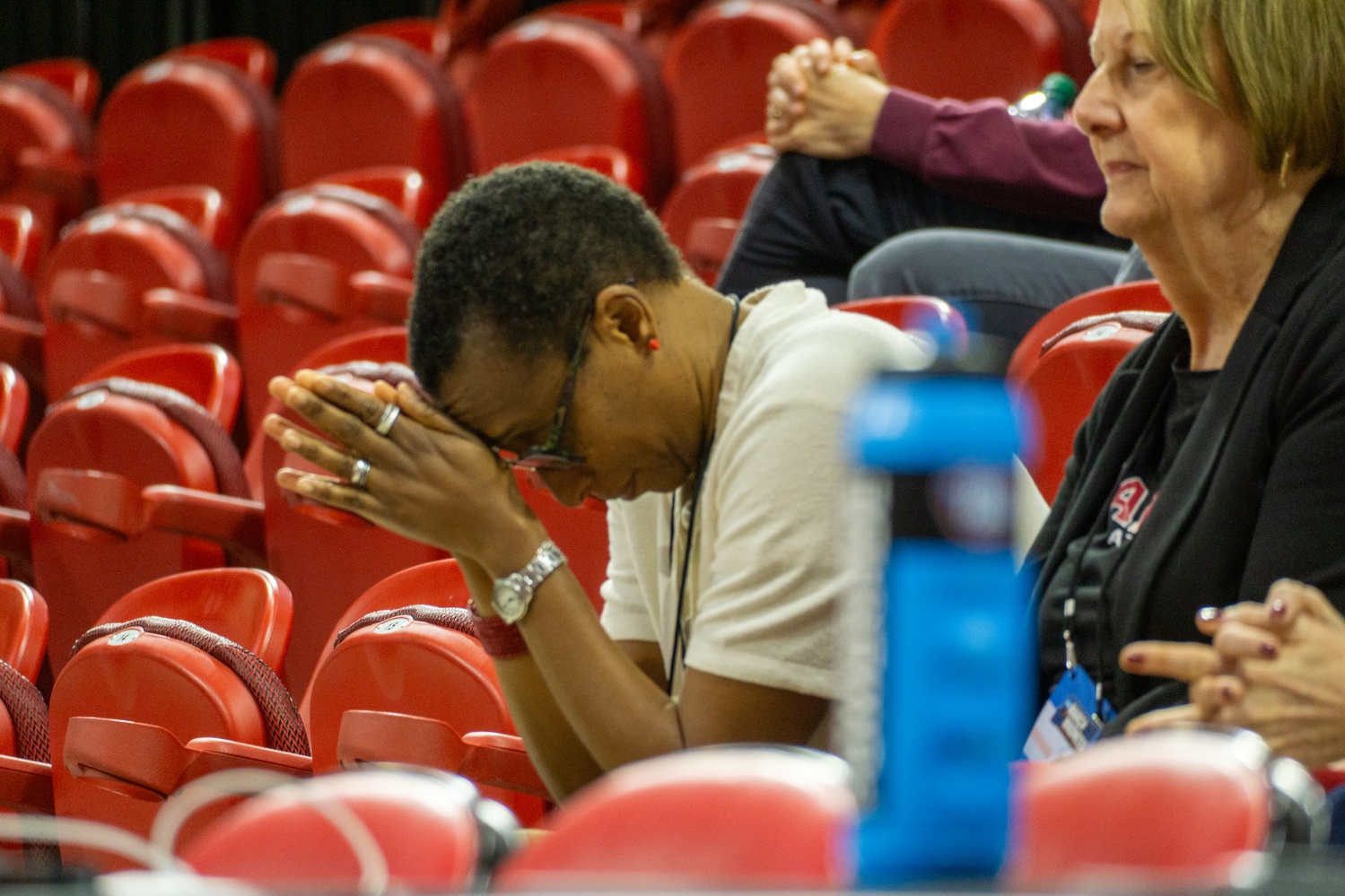 Former University President Claudine Gay holds her head in her hands as Michigan State increases its lead over the Harvard women’s basketball team.