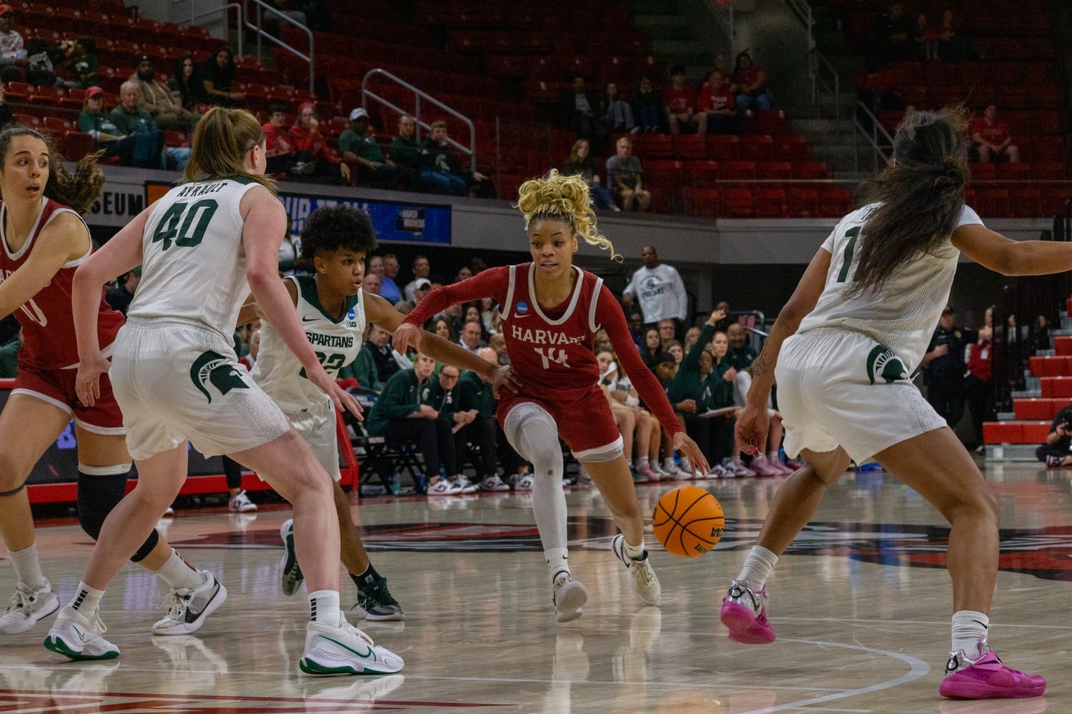 Senior guard Harmoni Turner fights through Michigan State's defense at March Madness. Turner became the fourth Harvard player drafted into the WNBA Monday.