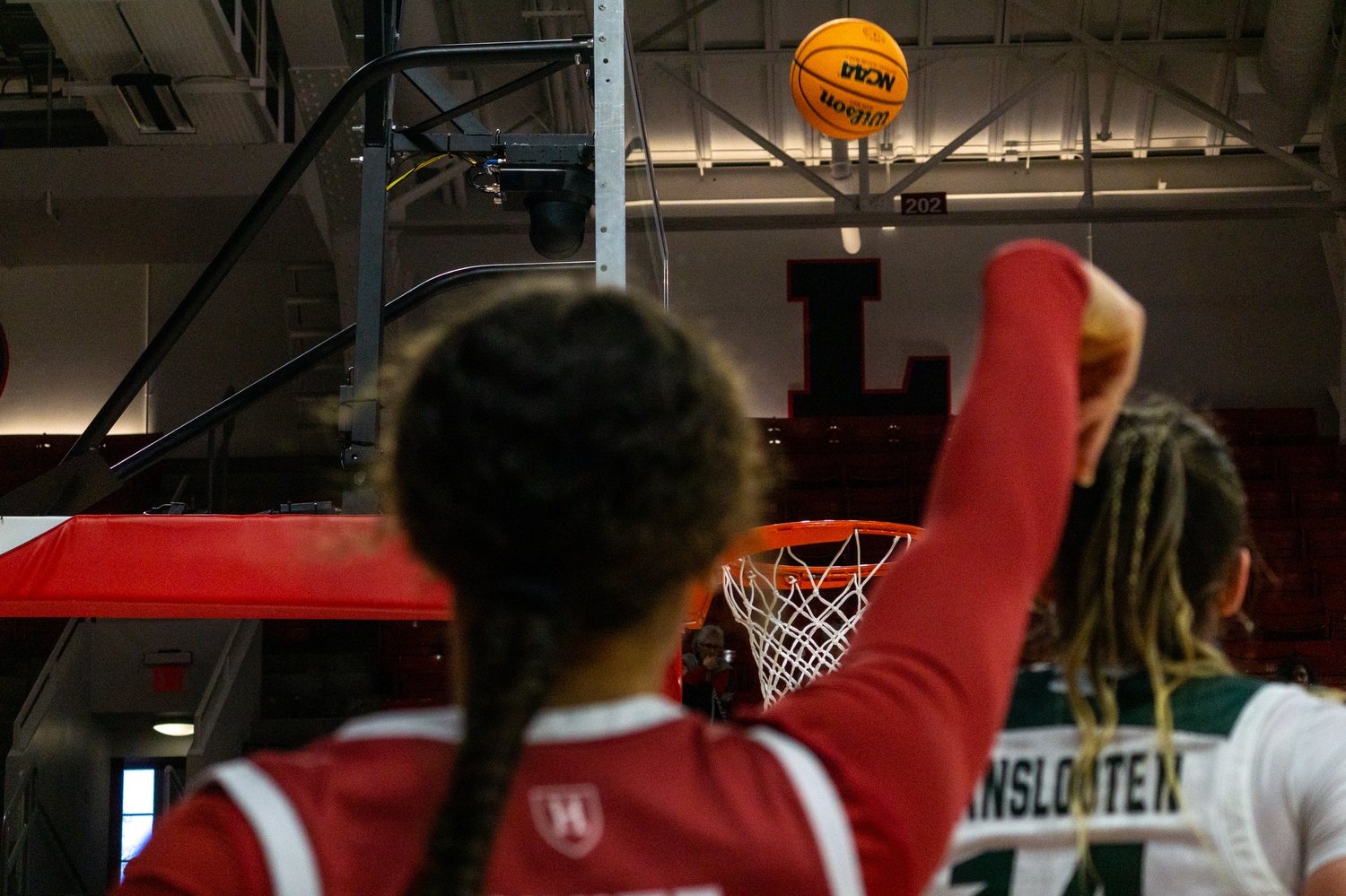 Sophomore Karlee White shoots a corner three. Harvard was forced to take desperation three-pointers in an attempt to stay alive against Michigan State.