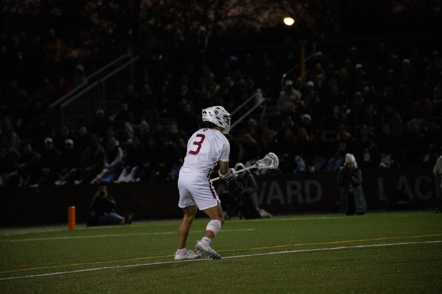 Junior Logan Ip observes the action during a play against Boston University.