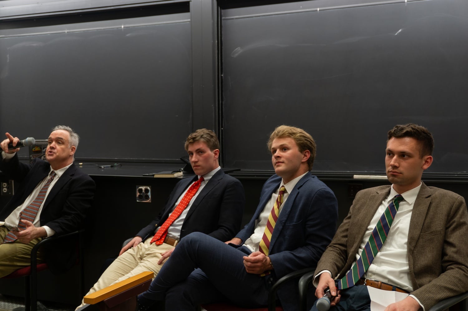 Harvard Republican Club gather for a debate against Harvard Democrats in the Science Center on Tuesday evening.