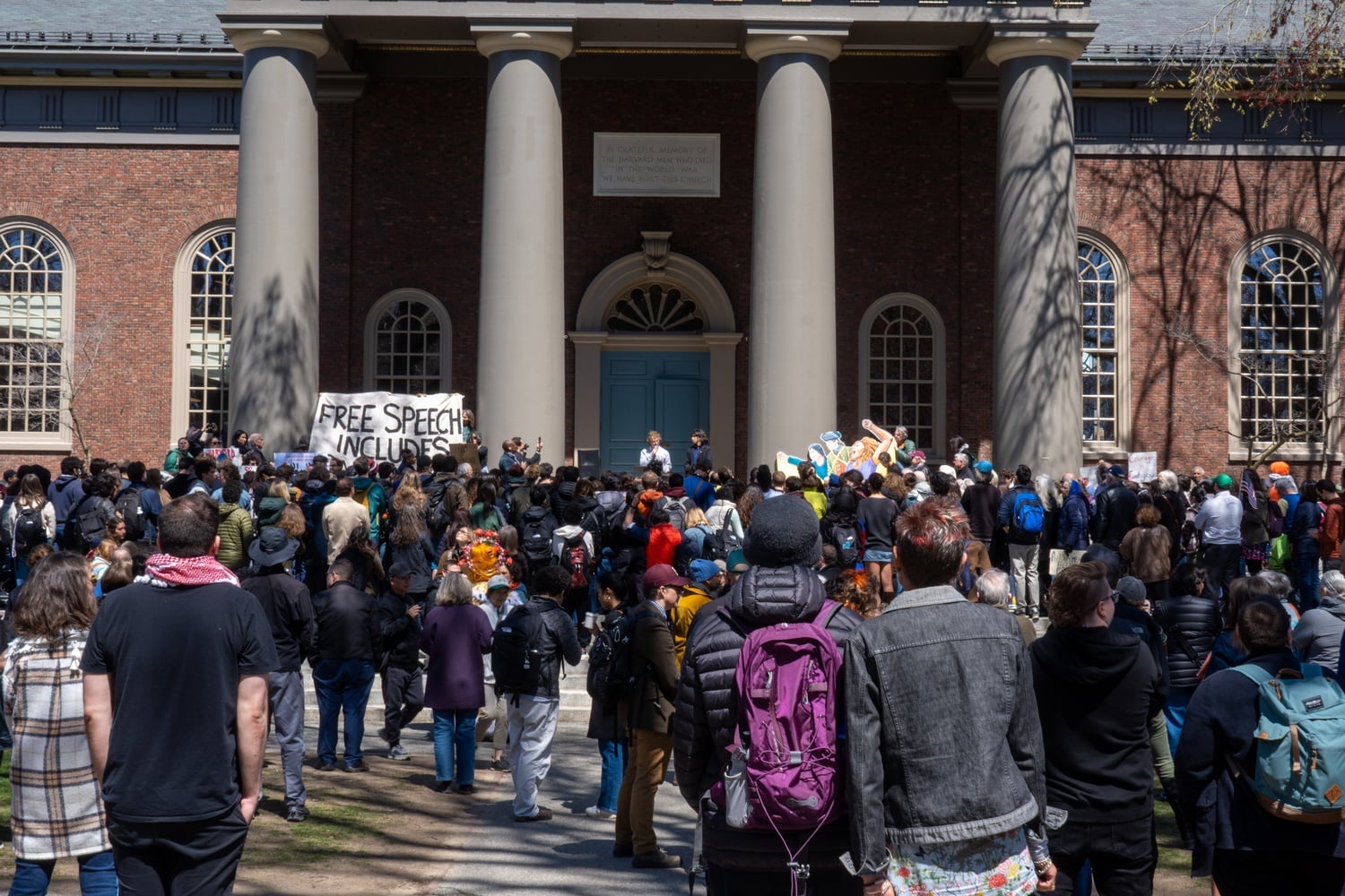 Students, faculty, and others gather in Tercentenary Theatre to protest against Trump's demands and for protections for international students on Thursday.