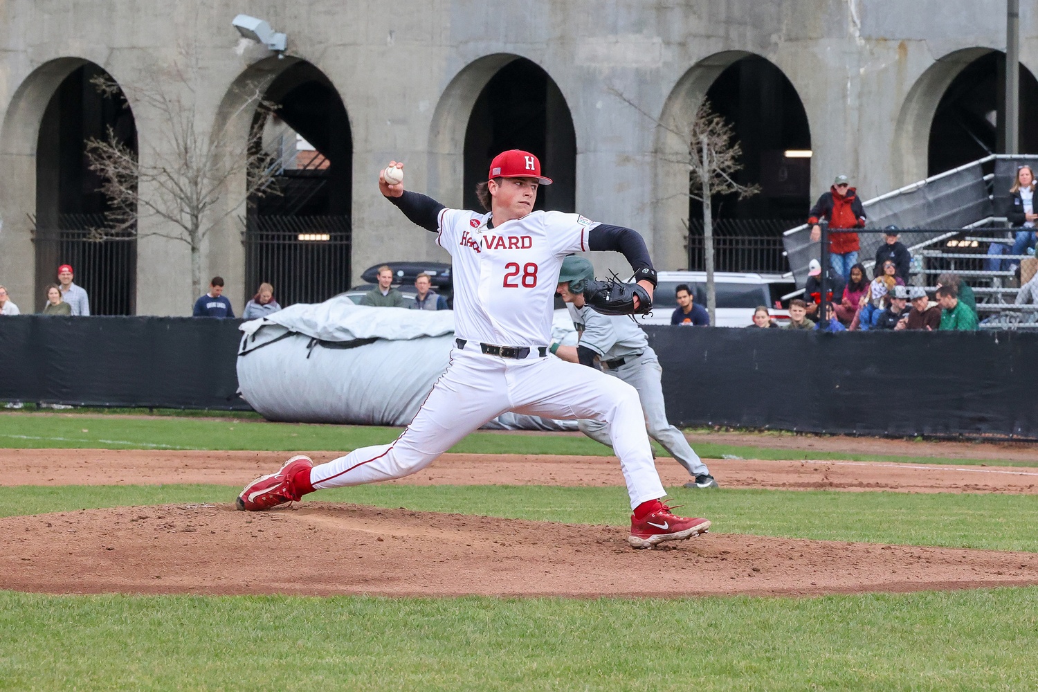 Sean Matson pitches against Dartmouth for Harvard. Matson is currently training with the Guardians.