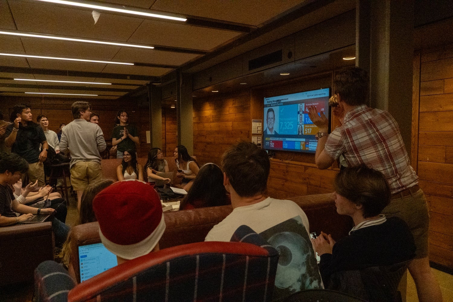 Students watch the Canadian election at a watch party hosted by the Harvard Canadian Club. Mark J. Carney '87, a former Harvard Overseer, was elected to a full term as Canadian prime minister. 