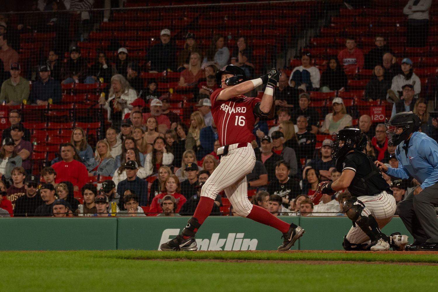 Senior catcher William Lybrook swings during the Beanpot final against Northeastern.
