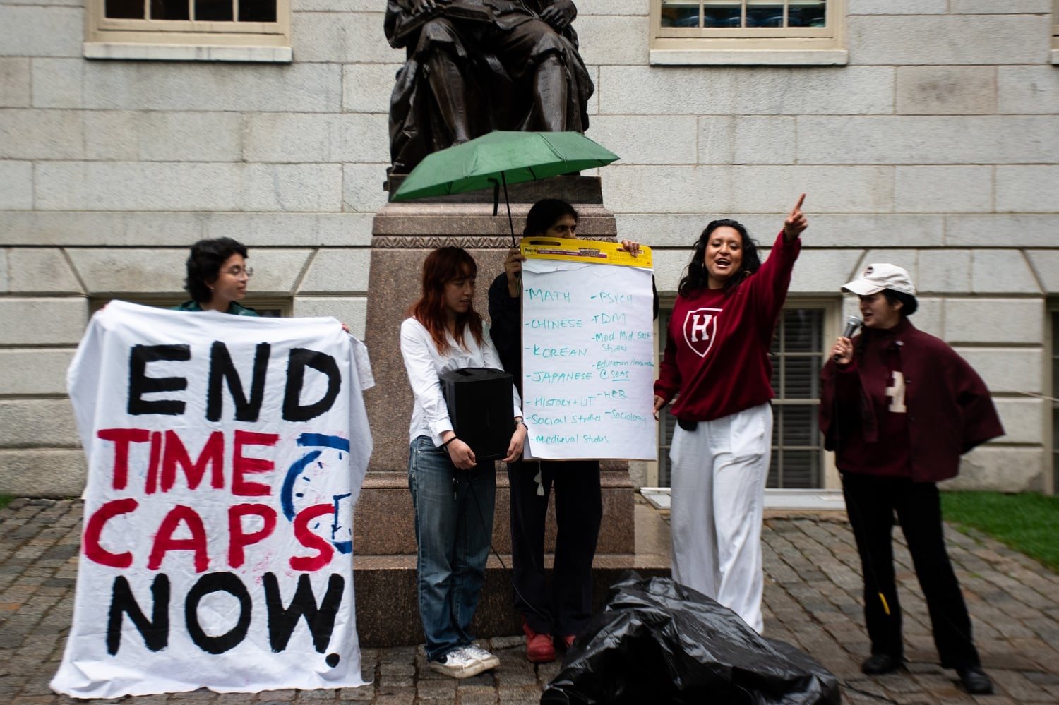Harvard College students gather in the yard to protest Harvard's timecaps on non-tenure track faculty positions.