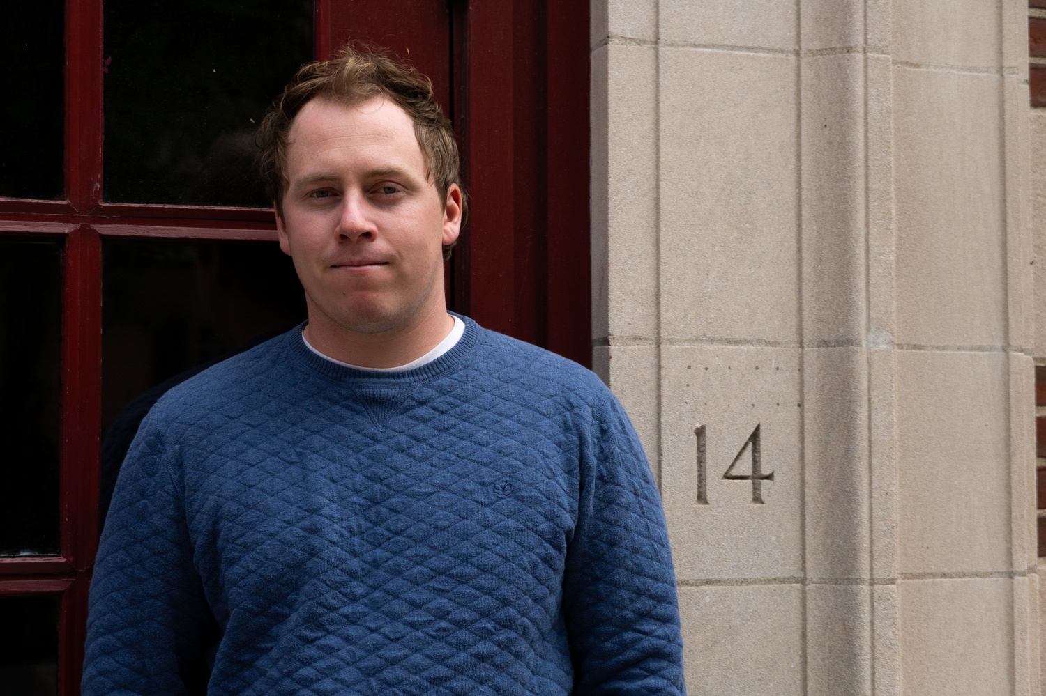 Thomas Harris stands in front of The Crimson