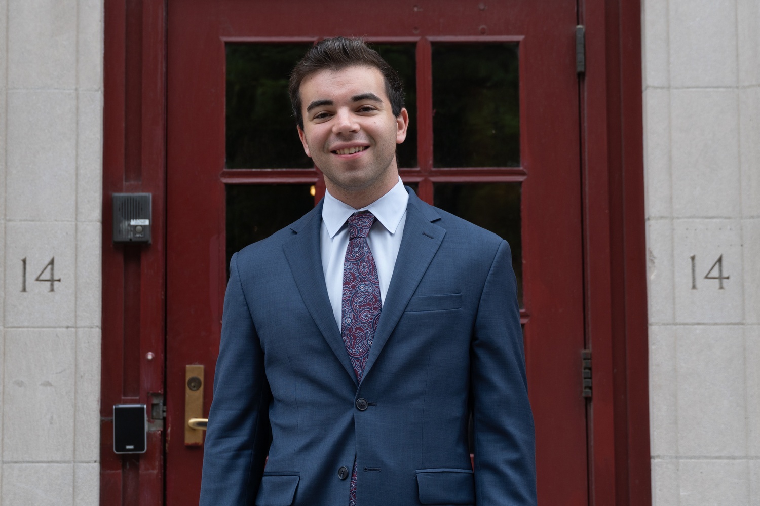 Jack Silvers, former sports chairs, poses in front of 14 Plympton Street.