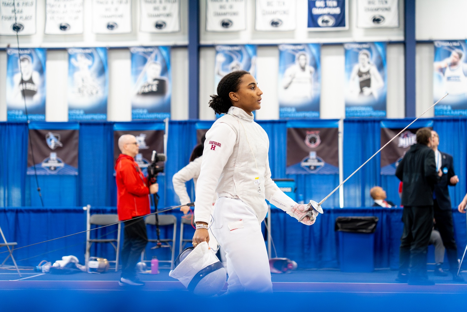 Lauren Scruggs fences for Harvard. Scruggs won an individual silver and team gold at the Olympics,
