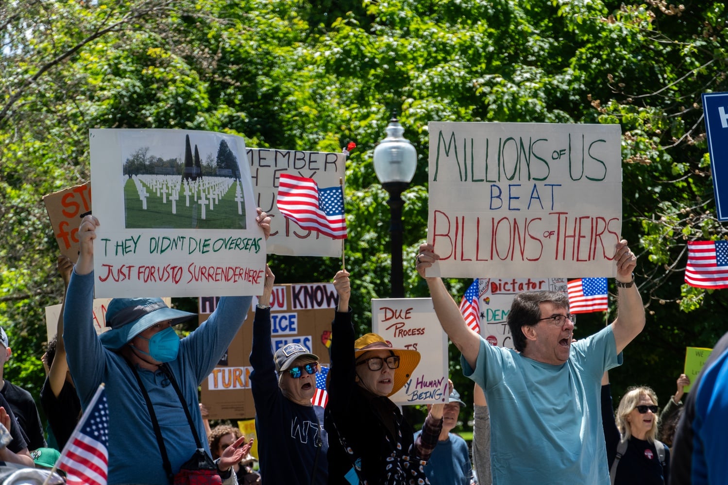 Protesters rallied in Boston against the Trump administration and Immigration and Customs Enforcement arrests.