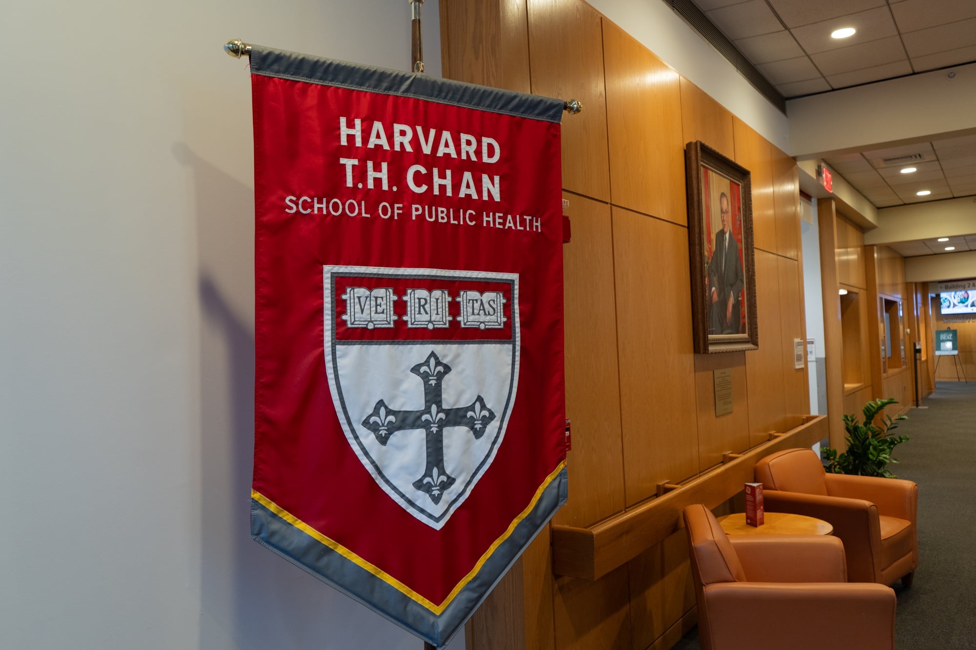 A banner hangs at the Harvard School of Public Health in May 2025.