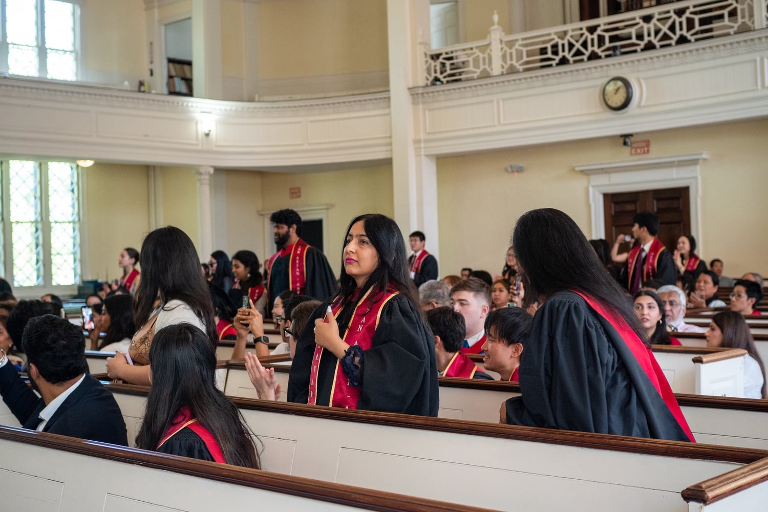 Graduates wear red stoles, purchased with money from an eleventh-hour student and alumni fundraiser, at the Asian, Pacific Islander, and Desi American affinity celebration.