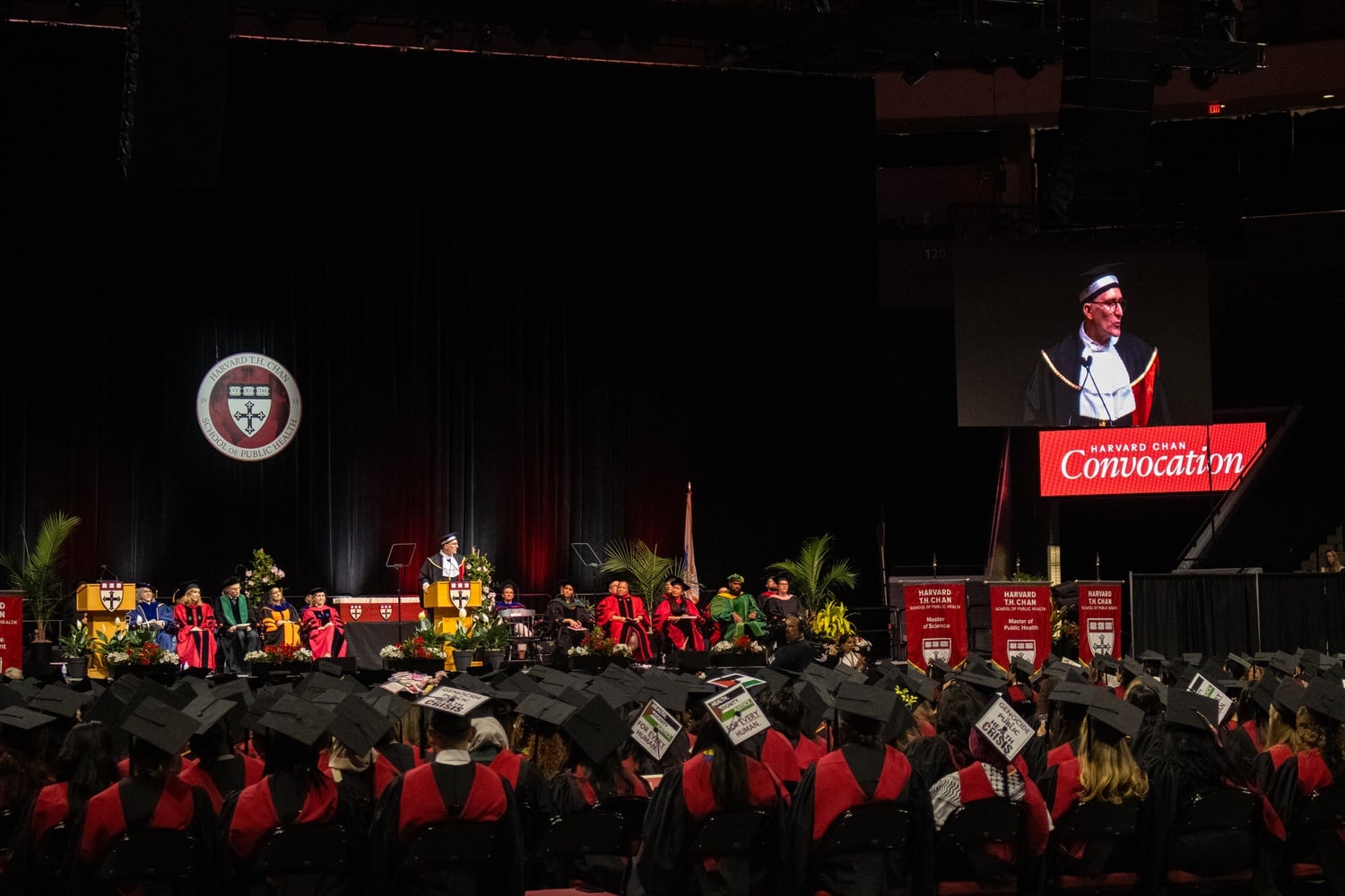 As Harvard School of Public Health Dean Andrea A. Baccarelli addressed the crowd at the school’s 2025 Convocation, some students wore caps decorated with pro-Palestine messaging.