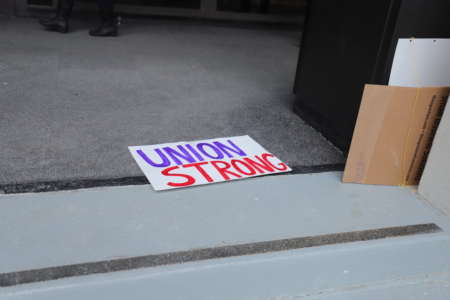 A ‘Union Strong’ sign lies on the ground at the Harvard Medical School during a 2019 HGSU-UAW strike. Hundreds of graduate students, including many at the Medical School, were removed from the union in July 2025.