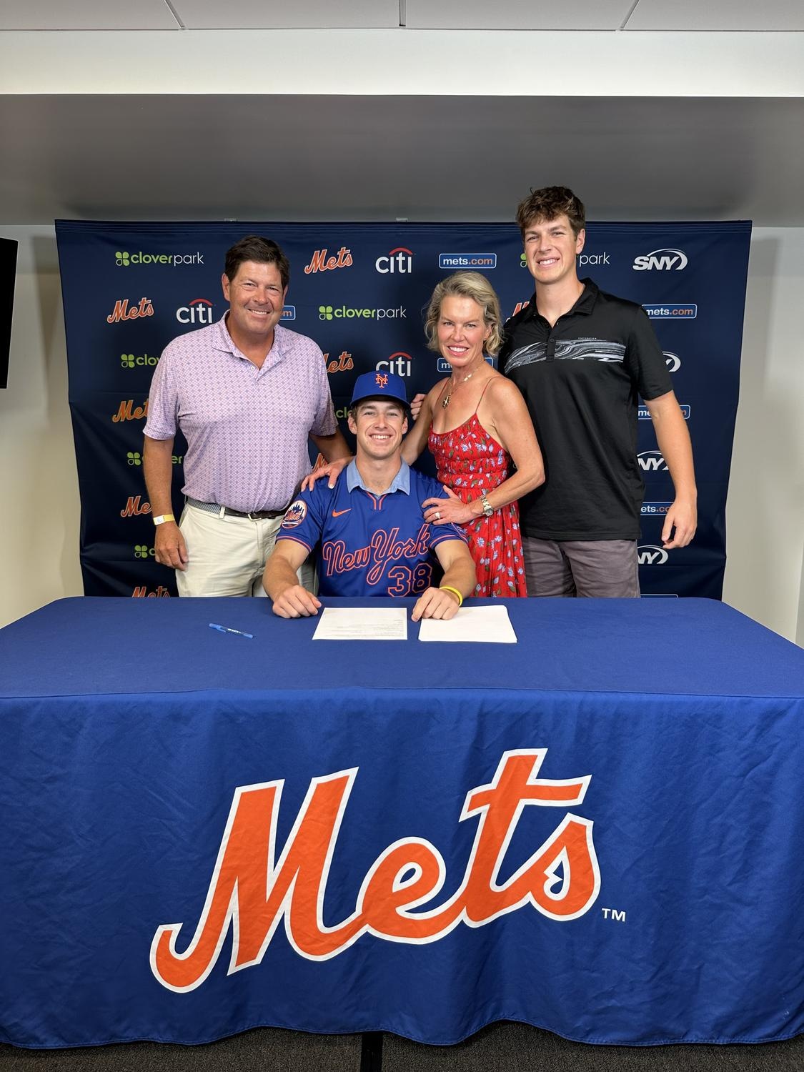 The Pauley family poses with Truman (seated) set to begin his professional baseball career.
