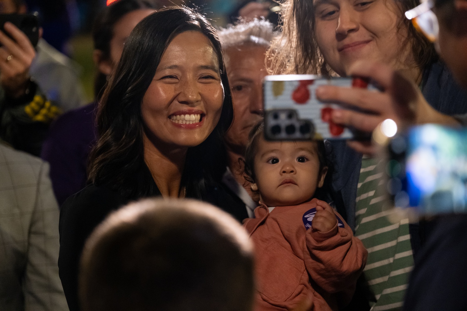 Wu poses for a photo with her daughter at Tuesday night's rally.
