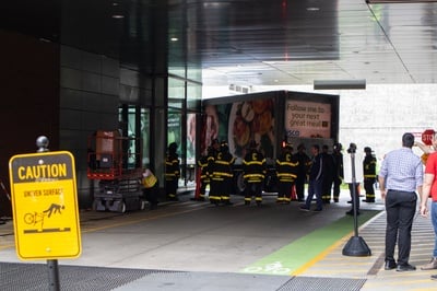 Cover image for Truck Hits Northwest Building, Causing Minor Damage and Temporary Street Closure