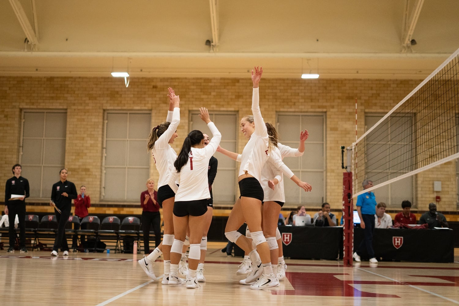 The women's volleyball team celebrates during its first homestand of the season.