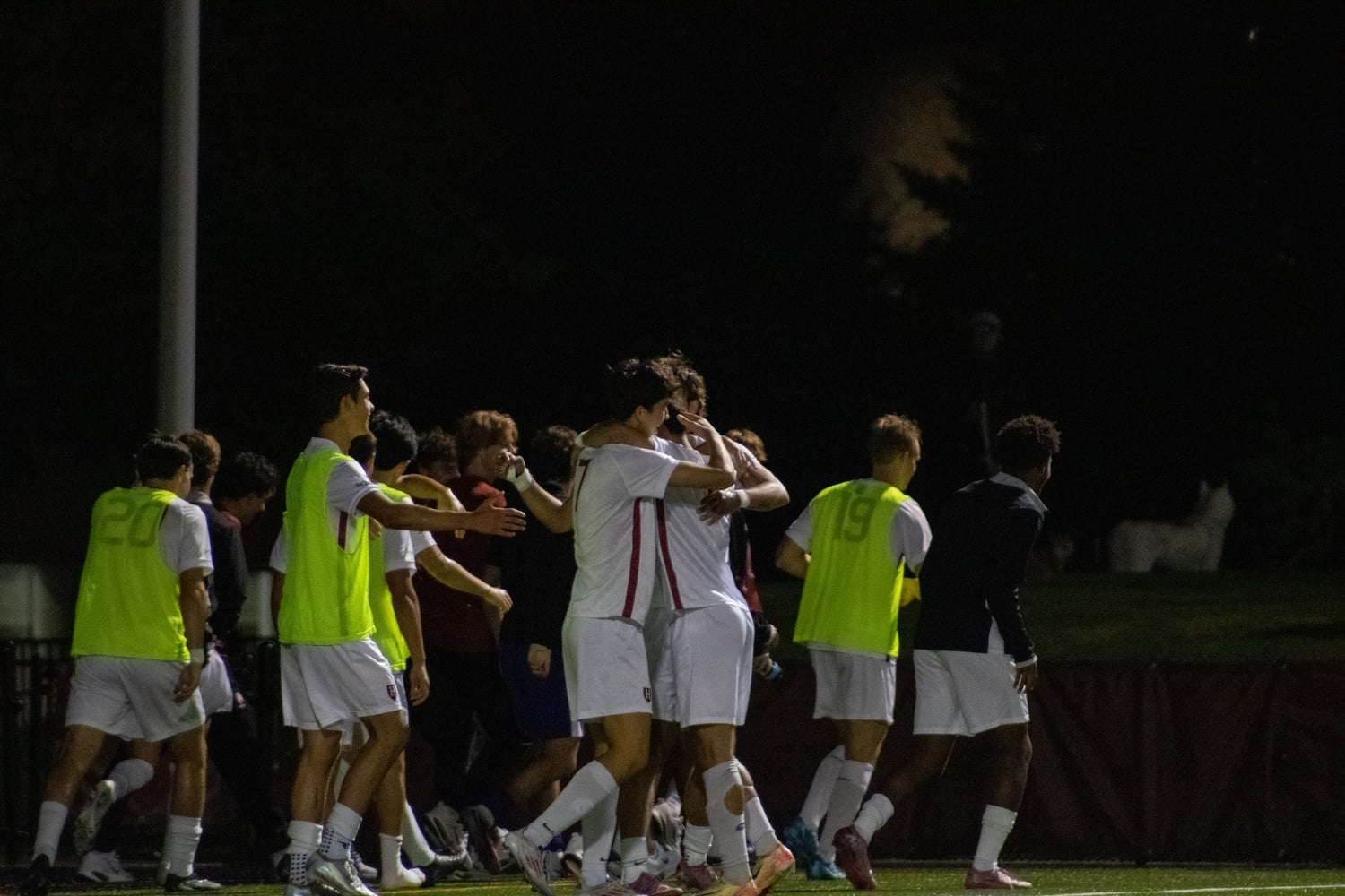 The men's soccer team celebrates during a victory over Cal earlier in the season.