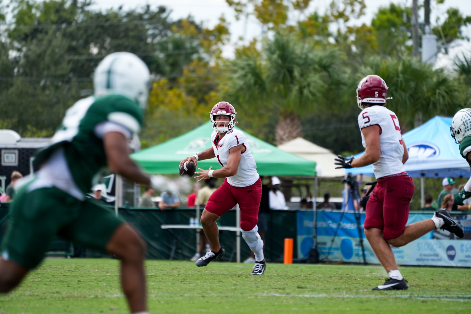 Senior quarterback Jaden Craig attempts a pass during the first half of the game.