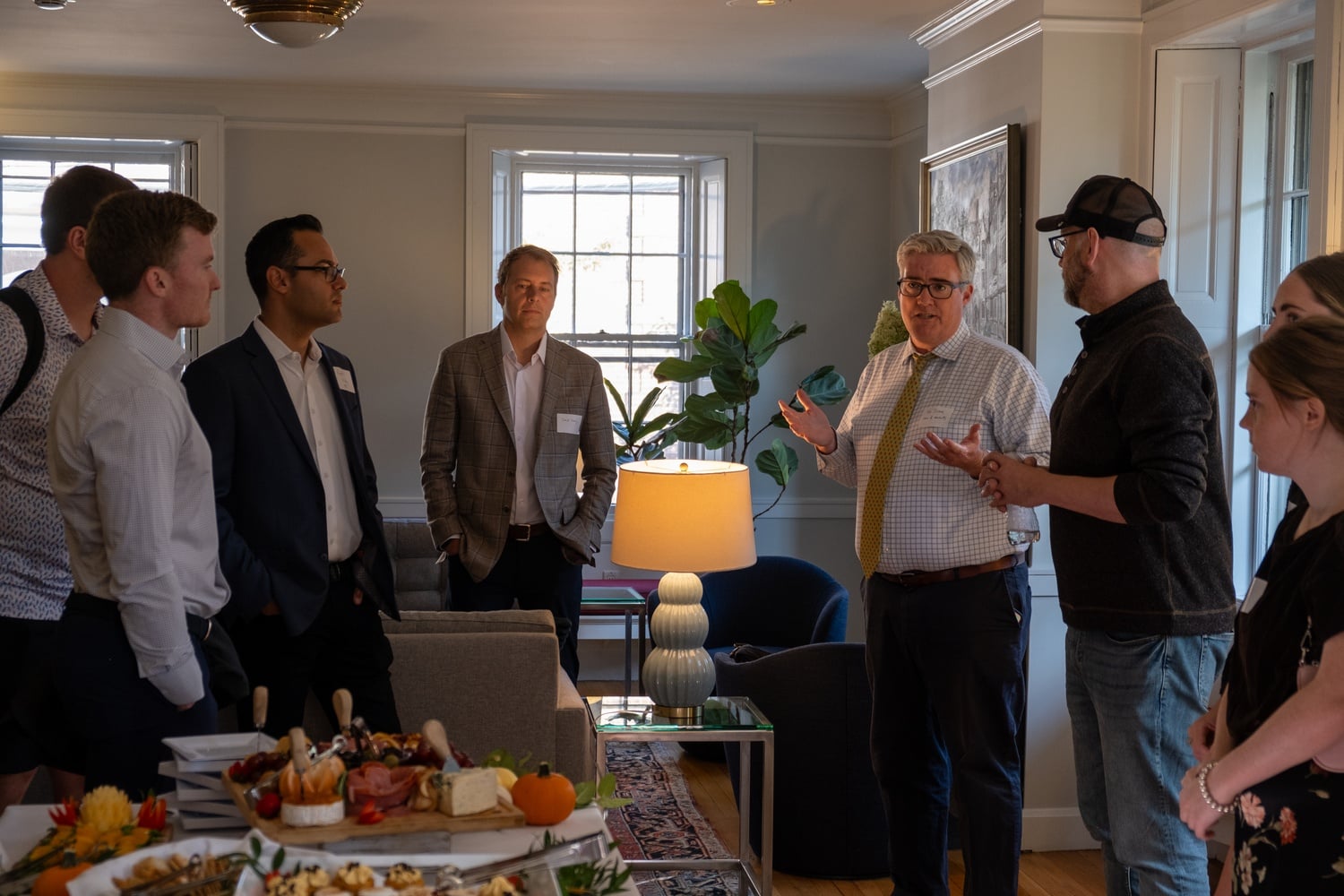 Dean of Students Thomas G. Dunne speaks to Republican students at his home. The gathering became one of the most visible examples of the College's outreach to conservatives.