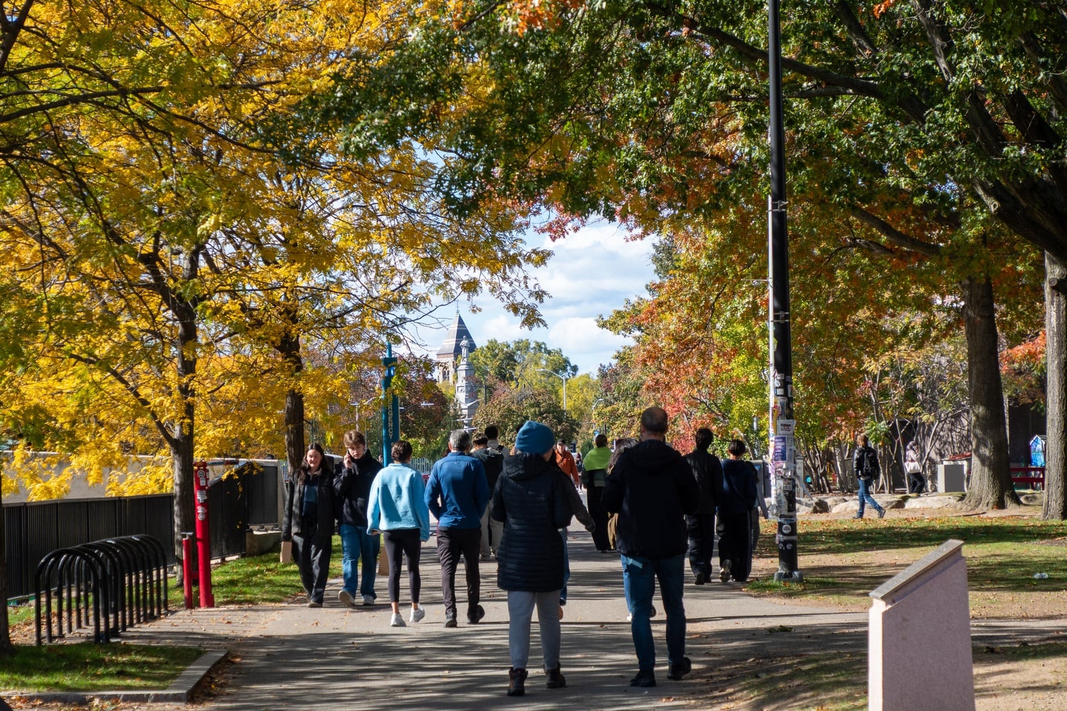 Parents walk around the Science Center plaza during family weekend.