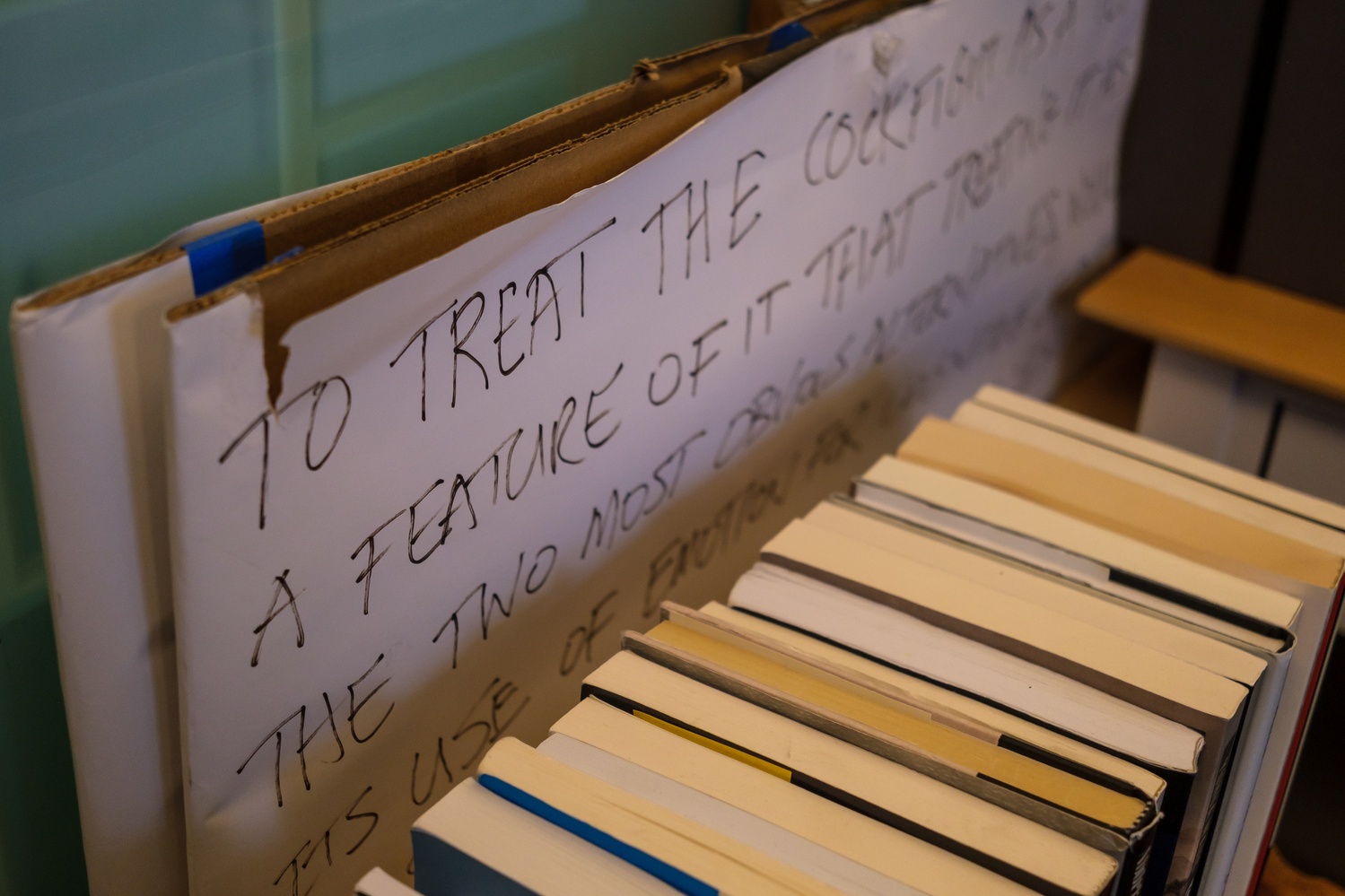 A cardboard slab that parodies Clifford Geertz’s essay “Deep Play: Notes on the Balinese Cockfight.”