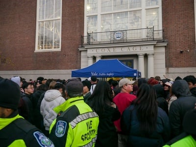 Cover image for Students Battle Crowds and Chaos to Retrieve Bags After Loss Against Yale