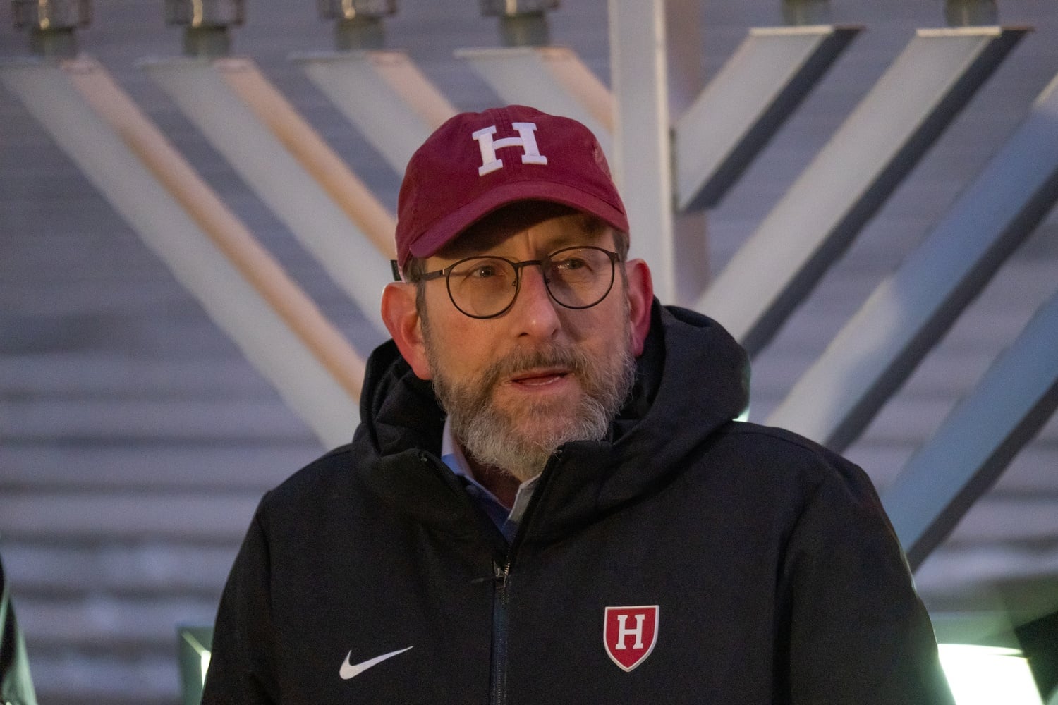 Harvard President Alan M. Garber '76 speaks at a Hanukkah celebration in December. He hosted a fireside chat with freshmen in the Barker Center on Tuesday.