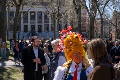 Cover image for Protestor in Costume at Hands Off Harvard Rally