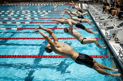 Cover image for Harvard Men's Swim Sweeps Brown in the 100-Yard Backstroke