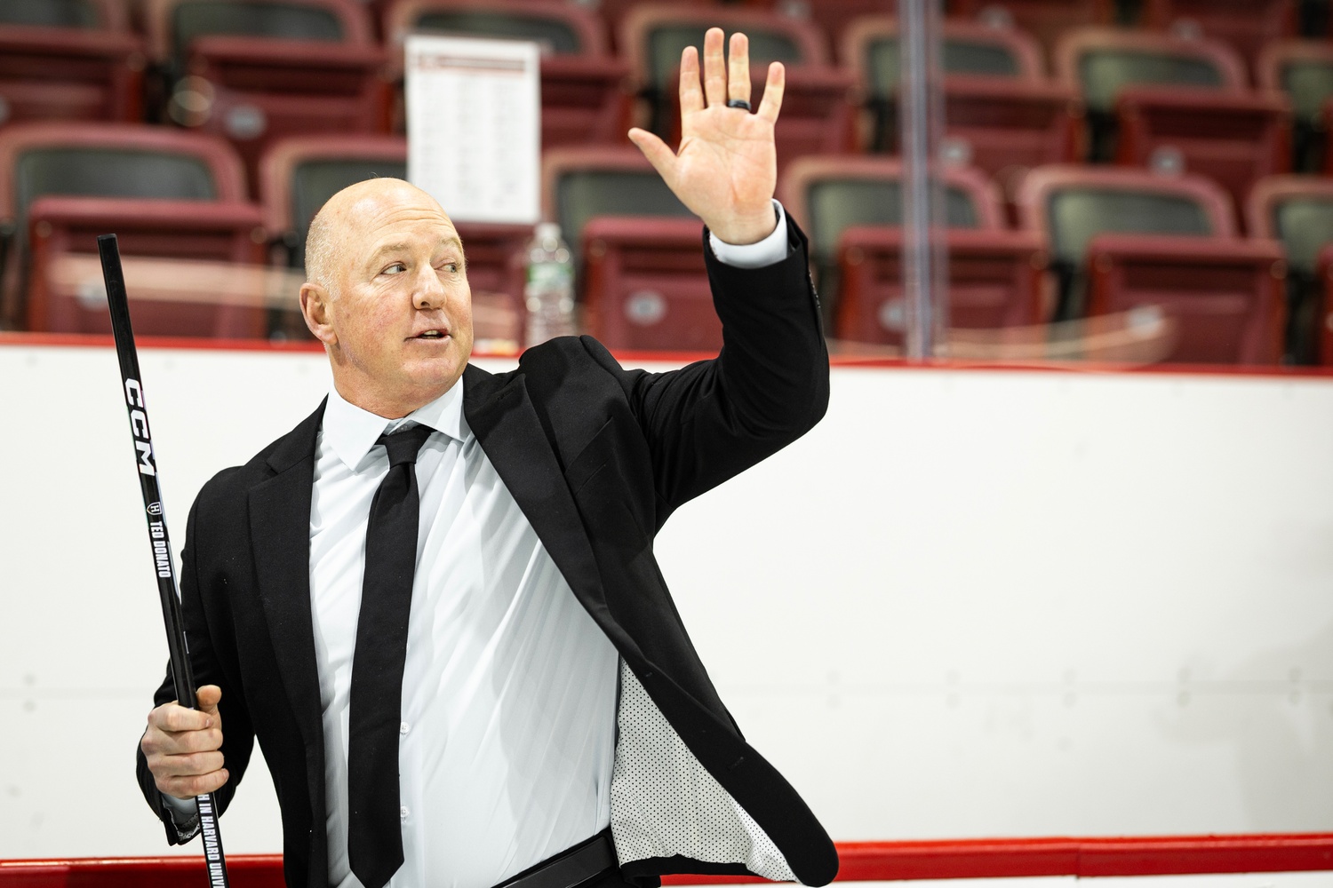 Head Coach Ted Donato '91 waves at the crowd during his ceremony in the Bright-Landry Hockey Center. 