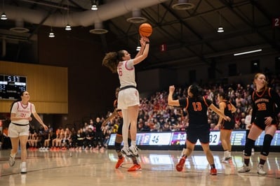 Cover image for Crimson Defense Smothers Penn in 53-42 Road Win