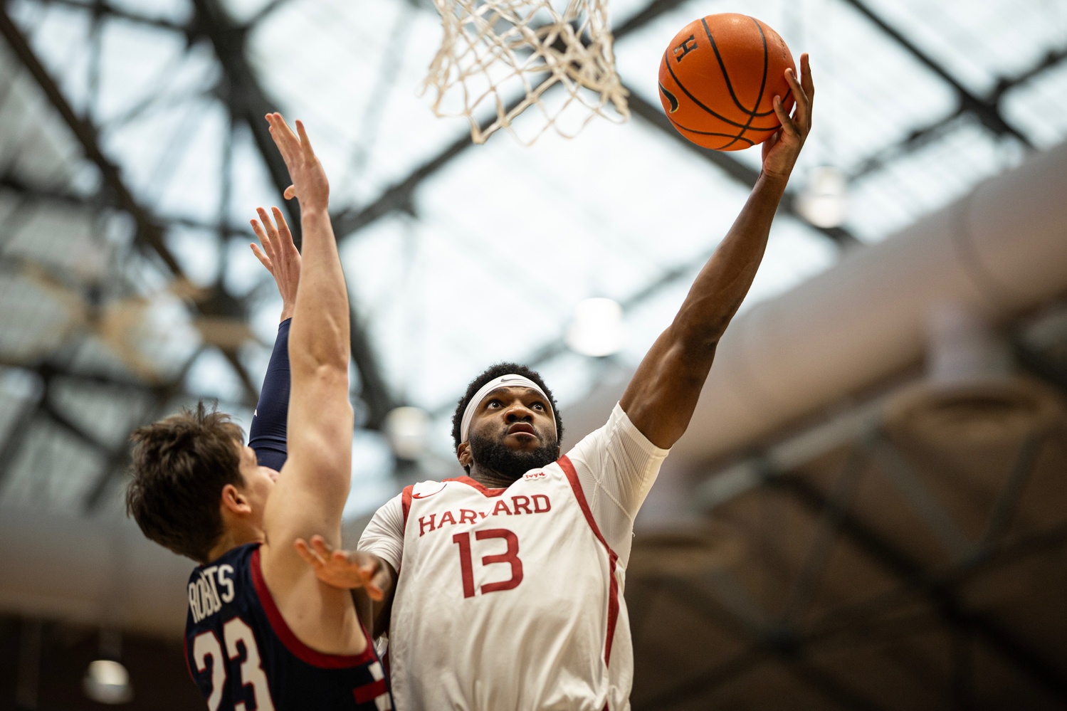 Captain Chandler Piggé drives to the hoop during the game against Penn.