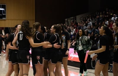 Cover image for Head Coach Moore in the Huddle
