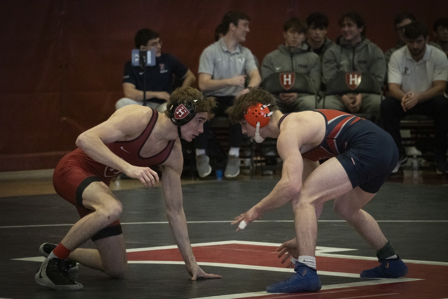 Harvard senior Dante Frinzi takes on the Quakers during the Crimson's senior day.