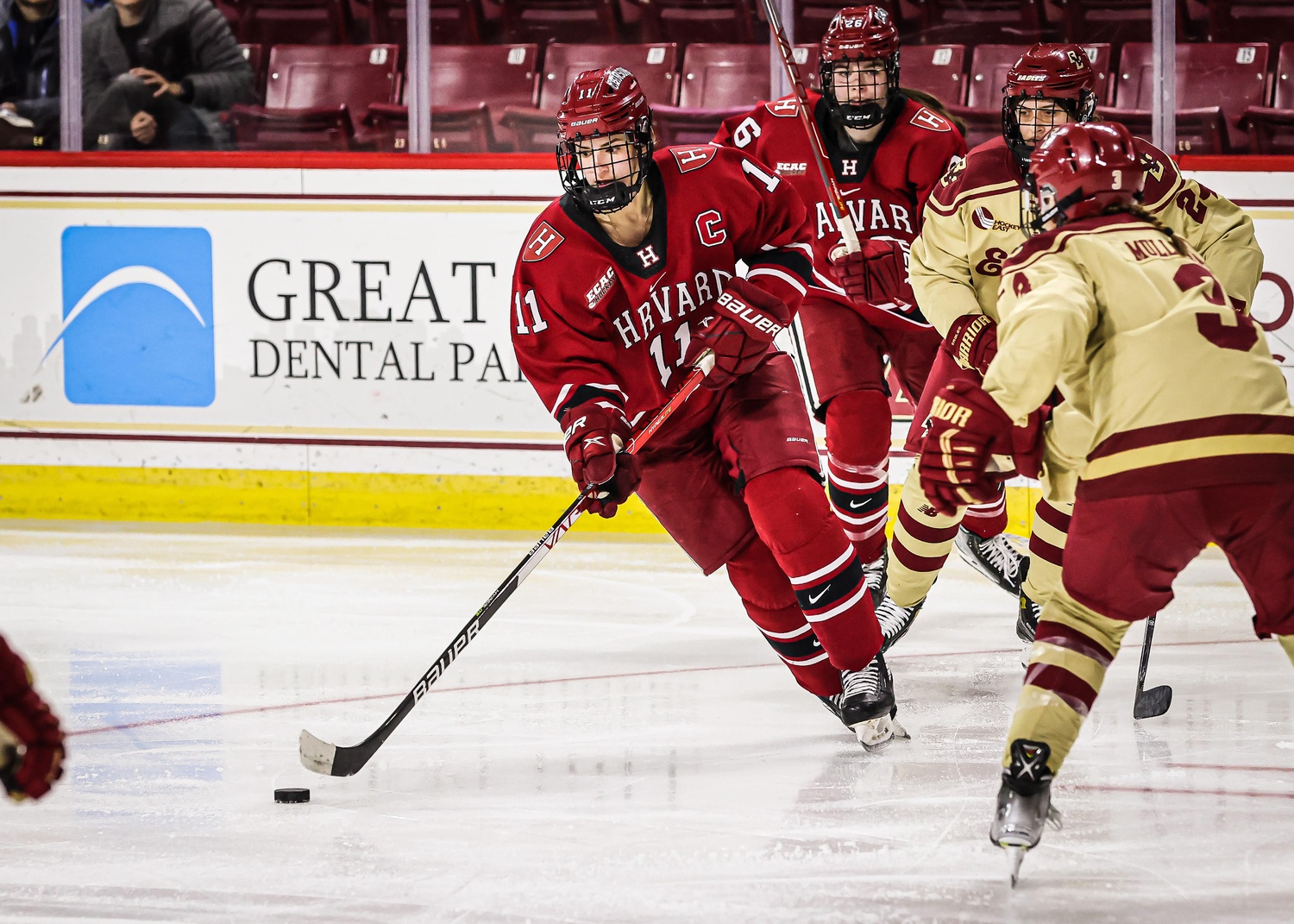 Kristin Della Rovere '23 skates past a defender from Boston College. The Crimson's former captain is lacing up her skates to compete for the Italian women's hockey team at the 2026 Winter Games.