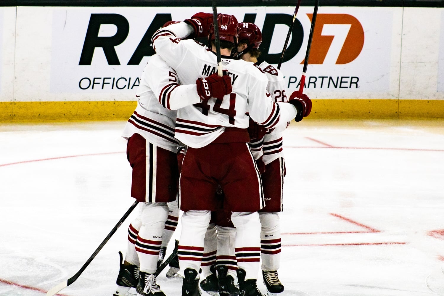 The men's hockey team celebrates a goal during its 4-1 win over Northeastern in the Beanpot consolation game.