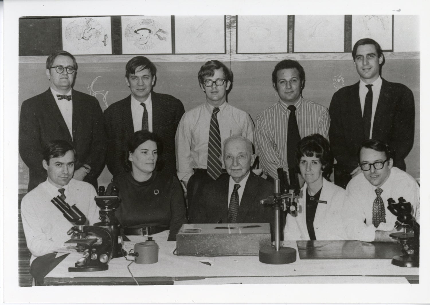 Yakovlev with a group of HMS neurologists in 1971. Slides from his collection are visible on the table.