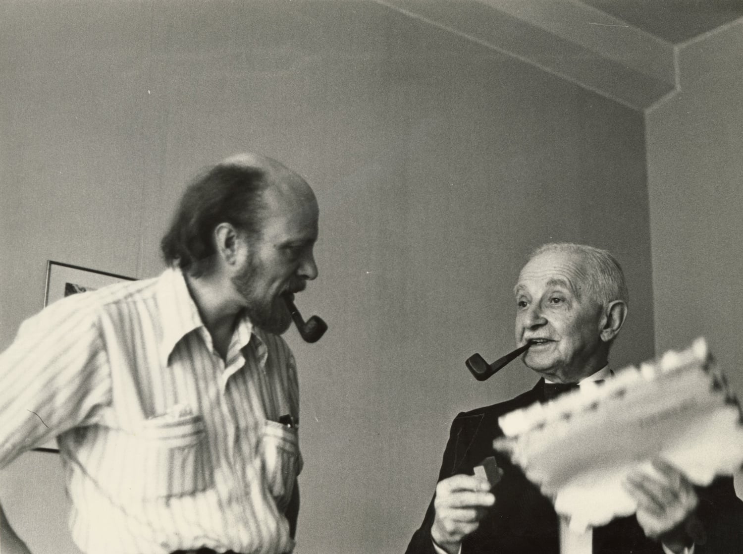 Yakovlev and a friend. Natasha R. Yakovlev describes her grandfather as always smoking a pipe and wearing a grey suit.
