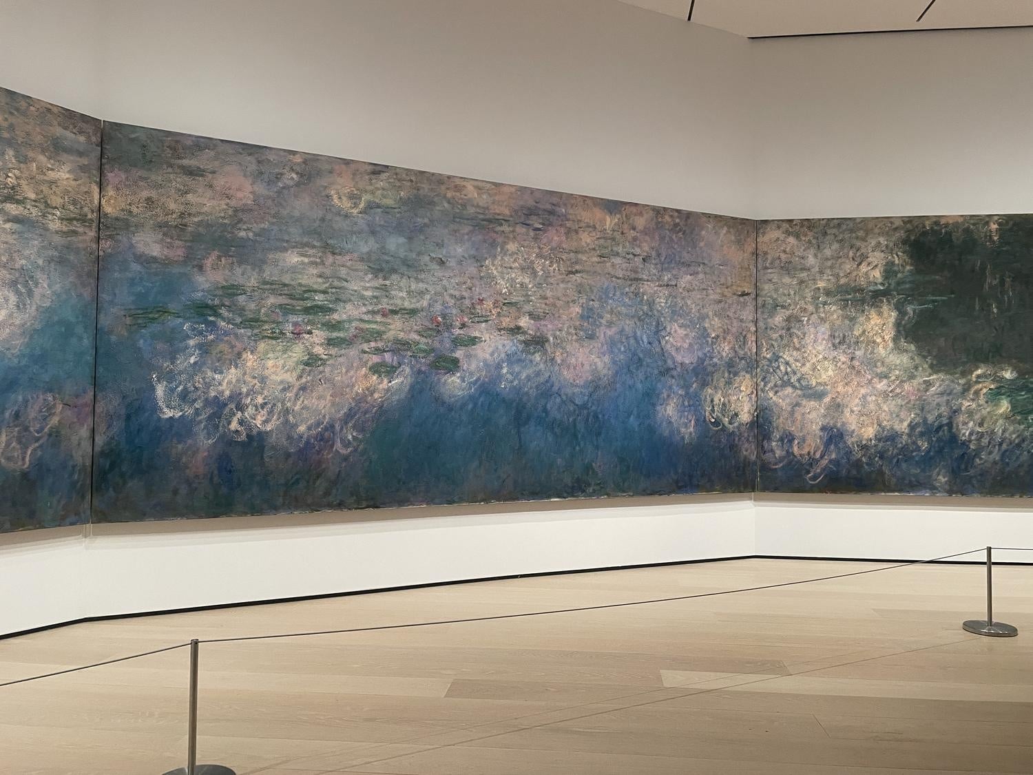 Visitors can find rest and relaxation at Monet's "Water Lillies" installation at the MoMa.