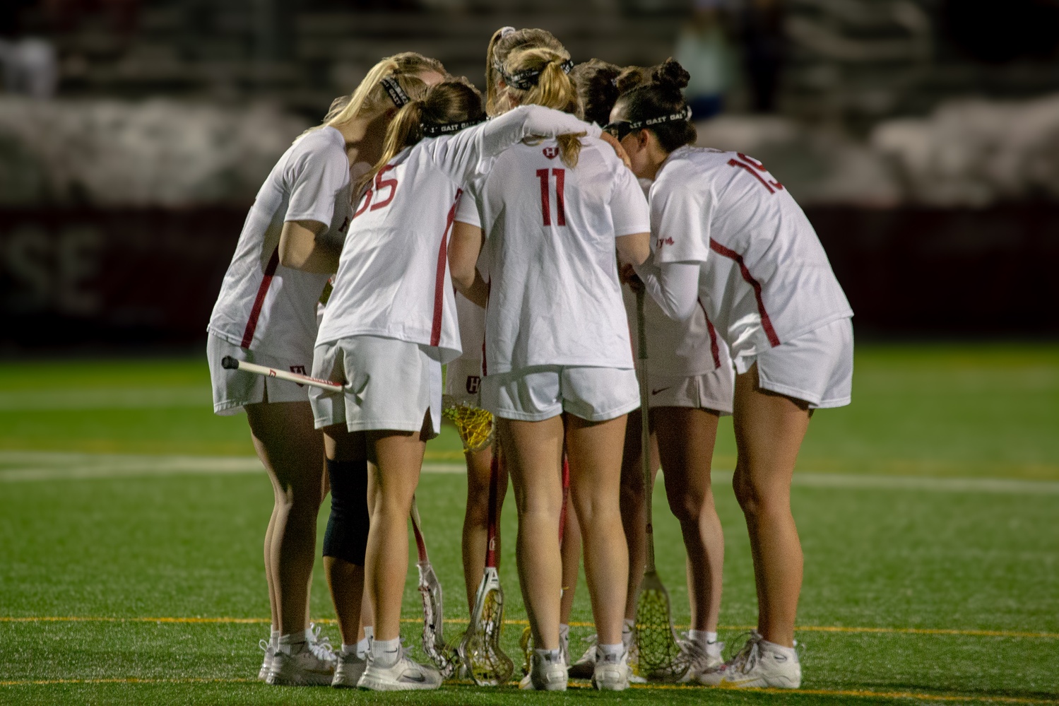 The women's lacrosse team huddles during its game against UConn last season.