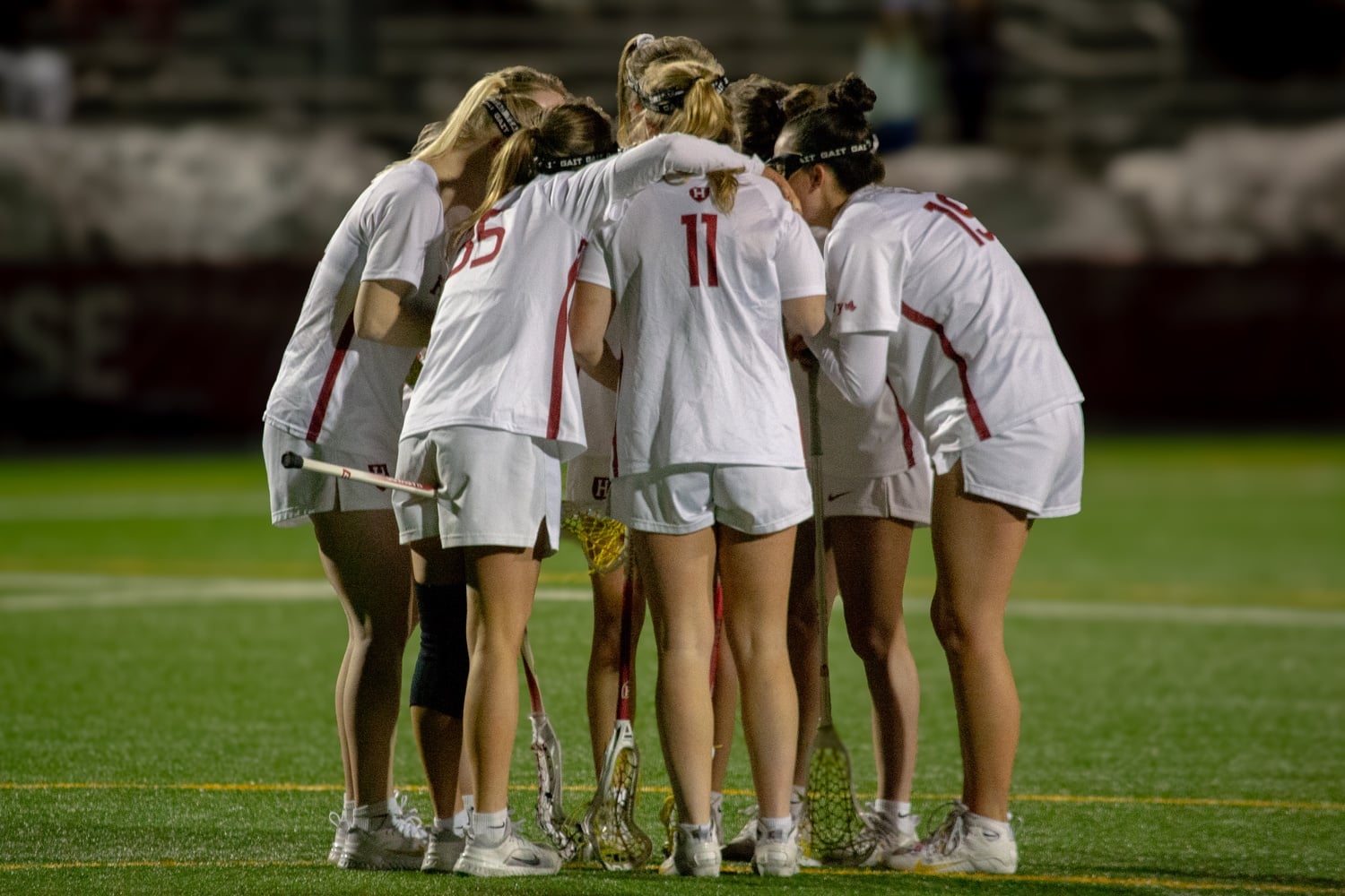 The women's lacrosse team huddles during its game against UConn last season.