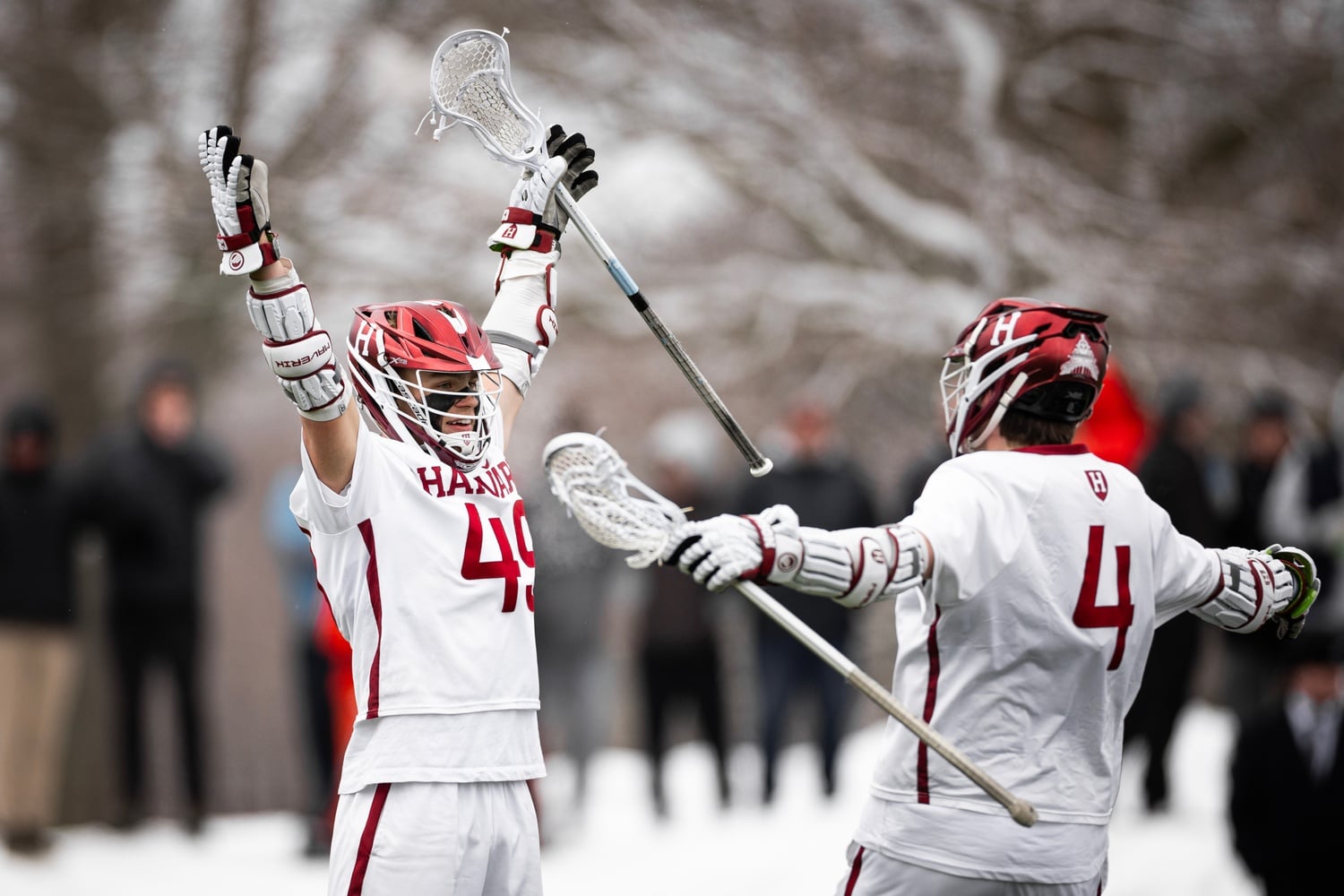Senior attacker John Aurandt IV and junior captain Jack Speidell celebrate the win over Syracuse.