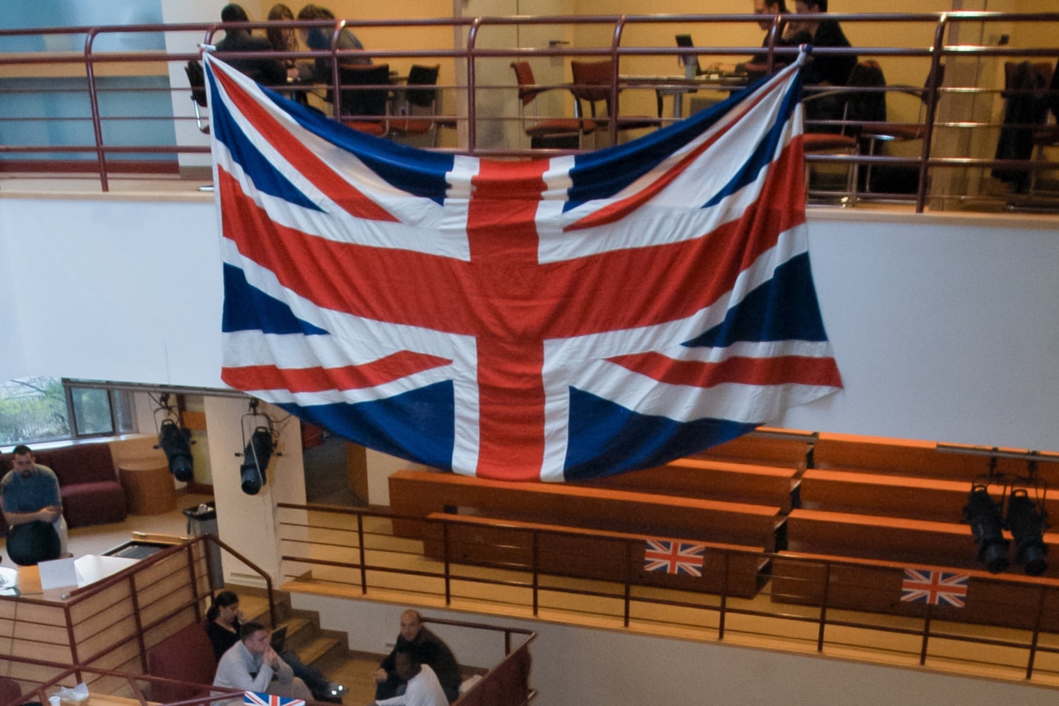 The United Kingdom flag at an Institute of Politics talk. Four Harvard affiliates were named 2026 Gates Cambridge Scholars and will pursue postgraduate study at the University of Cambridge.