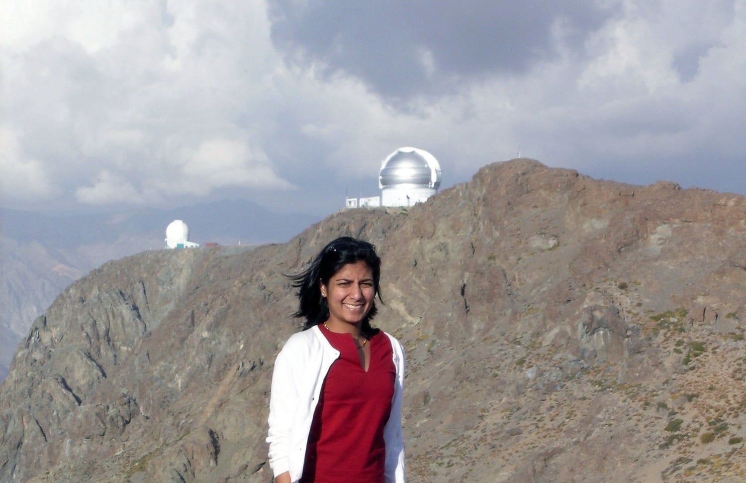 Arti Garg stands near the SOAR and Gemini South telescopes in Chile in February 2004. She said universities like Harvard should encourage open dialogue as political divides deepen on campus and beyond.